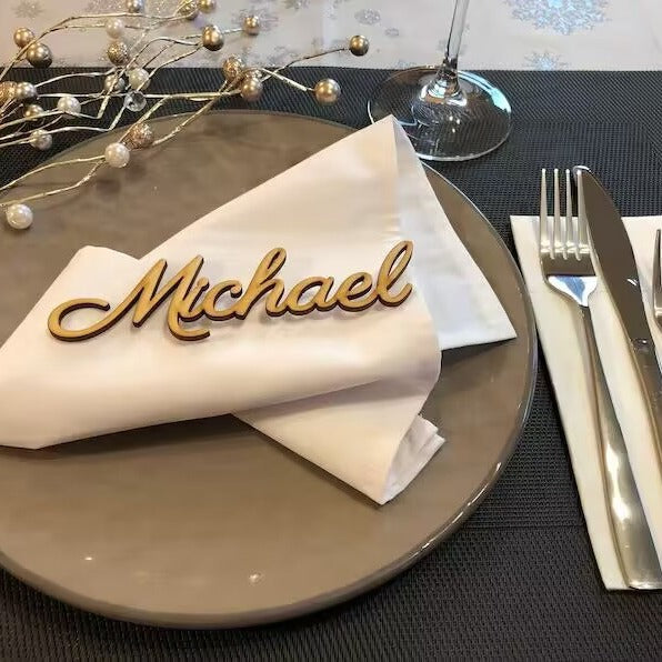 Place setting with personalized name on napkin.