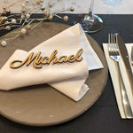 Place setting with personalized name on napkin.