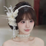 Woman with white floral bridal headpiece for wedding
